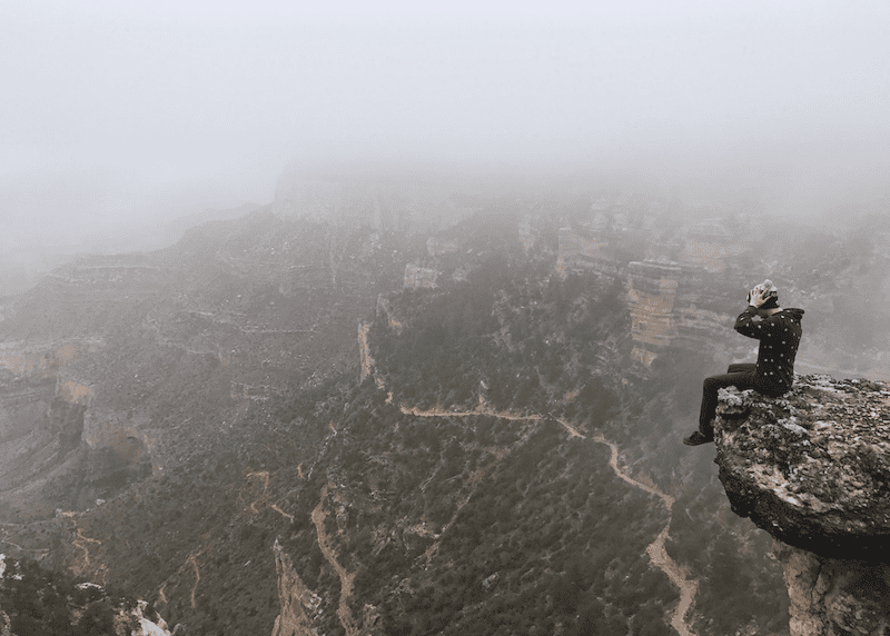 A hiker looking out over an immense vista, demonstrating what business feels like.