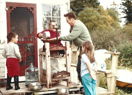 My family cleaning out an old wooden cider press on our back deck in about 1989.